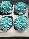 Chocolate cupcakes with blue frosting